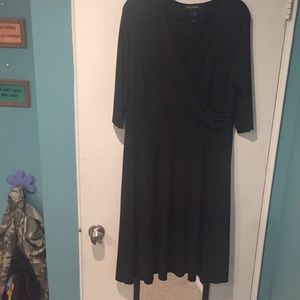 Black dress. Faux wrap top. 3/4 sleeves Kneelength